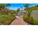 Lush backyard view leads to a refreshing pool, promising tranquil summer days in a private oasis at 13007 N 1St St, Phoenix, AZ 85022