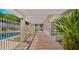 Covered patio offers shade alongside a pristine pool, enhancing outdoor leisure and backyard appeal at 13007 N 1St St, Phoenix, AZ 85022