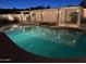 Tranquil pool area lit at night, perfect for a serene evening swim or relaxation by the water at 13007 N 1St St, Phoenix, AZ 85022