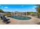 Relaxing pool area with comfy blue chairs, providing a tranquil outdoor living space with a refreshing pool at 13007 N 1St St, Phoenix, AZ 85022
