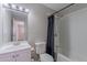 Bathroom featuring a shower-tub combo, vanity, and a mirror at 1325 W 7Th Ave, Mesa, AZ 85202