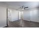 Bright bedroom features wood-look floors, ceiling fan, closet, and ensuite bathroom at 1325 W 7Th Ave, Mesa, AZ 85202