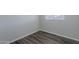 Cozy bedroom with wood-look floors and natural light at 1325 W 7Th Ave, Mesa, AZ 85202