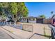 Charming home featuring a freshly painted exterior, manicured yard, and convenient driveway at 1325 W 7Th Ave, Mesa, AZ 85202