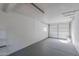 Spacious, clean garage with concrete floor and white walls at 1325 W 7Th Ave, Mesa, AZ 85202