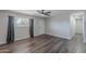 Bright living room with modern ceiling fan, hard surface floors and ample light at 1325 W 7Th Ave, Mesa, AZ 85202