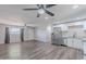 Open concept living space featuring a new kitchen, hard surface floors, and modern ceiling fans at 1325 W 7Th Ave, Mesa, AZ 85202