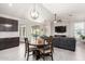 Bright living space with dining area and a view of the outdoor pool through sliding glass doors at 13561 W Montebello Ave, Litchfield Park, AZ 85340