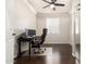 Home office with ceiling fan, closet with mirrored doors, and large window with lots of natural light at 13561 W Montebello Ave, Litchfield Park, AZ 85340