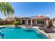 Inviting pool area features a shaded pergola, lounge chairs, and ample deck space for entertaining at 13561 W Montebello Ave, Litchfield Park, AZ 85340