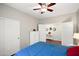 Well-lit bedroom with wooden floors, a ceiling fan, and ample closet space at 146 E Rock Wren Dr, San Tan Valley, AZ 85143