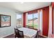Bright dining room with hardwood floors, large windows, and seating for six at 146 E Rock Wren Dr, San Tan Valley, AZ 85143