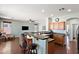 Open-concept kitchen with breakfast bar, dark countertops, and wood cabinets at 146 E Rock Wren Dr, San Tan Valley, AZ 85143