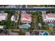 Real estate showcasing an aerial view of a home with mature trees, a pool, and a well-maintained yard at 1532 N Ogden --, Mesa, AZ 85205