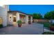 Covered backyard patio with plants and a large grassy area at 1532 N Ogden --, Mesa, AZ 85205