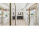 An open bathroom with dual sinks, a tub, and a glass-enclosed shower at 1532 N Ogden --, Mesa, AZ 85205