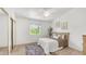 Bedroom featuring a ceiling fan, area rug, and ample natural light at 1532 N Ogden --, Mesa, AZ 85205