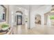 Welcoming foyer featuring elegant tile flooring, arched doorways, and ample natural light creating an inviting atmosphere at 1532 N Ogden --, Mesa, AZ 85205