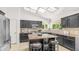 Spacious kitchen with stainless steel appliances, an island with seating, and a skylight at 1532 N Ogden --, Mesa, AZ 85205