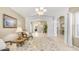 Inviting living room featuring neutral walls, tile floors, furniture, and abundant natural light at 1532 N Ogden --, Mesa, AZ 85205