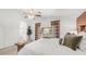 Bright main bedroom with plush bedding, slider to the balcony, and neutral decor, creating a tranquil retreat at 1532 N Ogden --, Mesa, AZ 85205