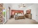 Spacious main bedroom with a large bed, dresser, and sliding glass door to a private balcony at 1532 N Ogden --, Mesa, AZ 85205