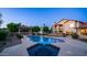 Inviting backyard with a pool, spa, gazebo, and beautifully landscaped surroundings, perfect for relaxation and outdoor entertainment at 1532 N Ogden --, Mesa, AZ 85205