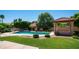 Relaxing pool view with gazebo and well-maintained landscaping, perfect for outdoor entertaining and leisure at 1532 N Ogden --, Mesa, AZ 85205