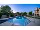 Backyard featuring a sparkling pool, lush landscaping, and a covered gazebo, creating a serene oasis for outdoor enjoyment at 1532 N Ogden --, Mesa, AZ 85205