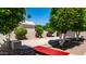 Side yard featuring mature citrus trees, a tidy layout, and practical elements for easy maintenance at 1532 N Ogden --, Mesa, AZ 85205