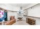 A well-organized walk-in closet with built-in shelving and a cushioned bench at 1532 N Ogden --, Mesa, AZ 85205