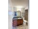 Bathroom featuring tiled shower and granite countertop at 1553 E Flower Cir, Mesa, AZ 85204