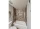 Bathroom with shower and tub combo with unique tiled feature at 1553 E Flower Cir, Mesa, AZ 85204
