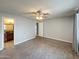 Spacious bedroom featuring carpet flooring and a view to the bathroom at 1553 E Flower Cir, Mesa, AZ 85204