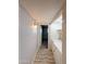 Hallway view featuring a washer and dryer at 1553 E Flower Cir, Mesa, AZ 85204