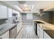 Renovated kitchen with granite countertops, stainless steel appliances, modern fixtures and ample storage at 1553 E Flower Cir, Mesa, AZ 85204