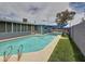 Backyard pool surrounded by well-maintained turf and privacy features in this inviting outdoor space at 1553 E Flower Cir, Mesa, AZ 85204