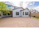 Spacious backyard features a covered patio, artificial turf, basketball court, and beautiful pavers, perfect for entertaining at 1634 W Red Bird Rd, Phoenix, AZ 85085