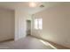 Bedroom featuring carpeting, a closet with sliding doors, and a window for natural light at 1634 W Red Bird Rd, Phoenix, AZ 85085