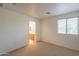 Bright bedroom featuring a large window with access to an ensuite bathroom at 1634 W Red Bird Rd, Phoenix, AZ 85085
