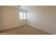 Neutral bedroom with carpet and large window, offering a serene and comfortable space at 1634 W Red Bird Rd, Phoenix, AZ 85085