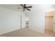 Bedroom featuring a ceiling fan, an ensuite bathroom, and closet access at 1634 W Red Bird Rd, Phoenix, AZ 85085