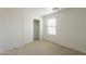 Bedroom with a closet, a window with blinds, and carpeted flooring at 1634 W Red Bird Rd, Phoenix, AZ 85085