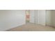 Bedroom featuring neutral carpet, and hallway and closet access at 1634 W Red Bird Rd, Phoenix, AZ 85085