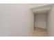 Walk-in closet with tile flooring, clothing rod, and additional space for storage or customization at 1634 W Red Bird Rd, Phoenix, AZ 85085