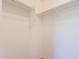 Walk-in closet with rods, providing ample storage space and organization at 1634 W Red Bird Rd, Phoenix, AZ 85085