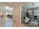 Open concept foyer leading into a bright living area and separate office space at 1634 W Red Bird Rd, Phoenix, AZ 85085