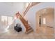 Inviting foyer features tile flooring, a staircase, and ample natural light creating a grand entrance at 1634 W Red Bird Rd, Phoenix, AZ 85085