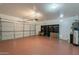 Spacious two-car garage with epoxy flooring and ample storage space, great for vehicles and projects at 1634 W Red Bird Rd, Phoenix, AZ 85085