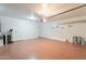 Spacious garage with epoxy flooring, overhead lighting, and plenty of storage, offering functionality at 1634 W Red Bird Rd, Phoenix, AZ 85085